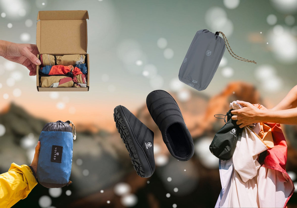 Collage of VOITED products against a blurred mountain backdrop: black slippers, liners in a gift box, the Tout Pack and the Sandfree Beach Sheet in their compact stuff sacks.